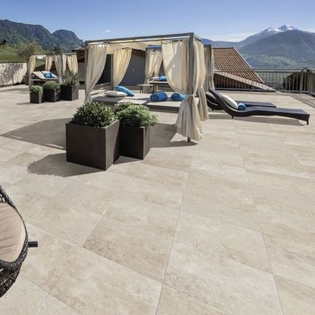 Porcelain Paver in outdoor space, Ottimo Oasis Matte Porcelain Paver in Outdoor Space, Image is showing a big outdoor space having patio and wicker furniture, and a porcelain paver installed on floor