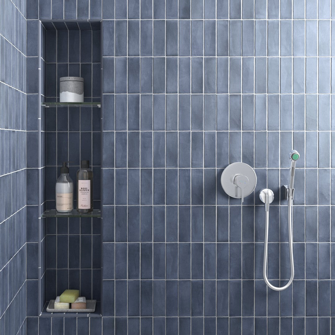 blue 2x6 matte shower tile, image is showing blue matte tile with facuets, and showers, and buttons