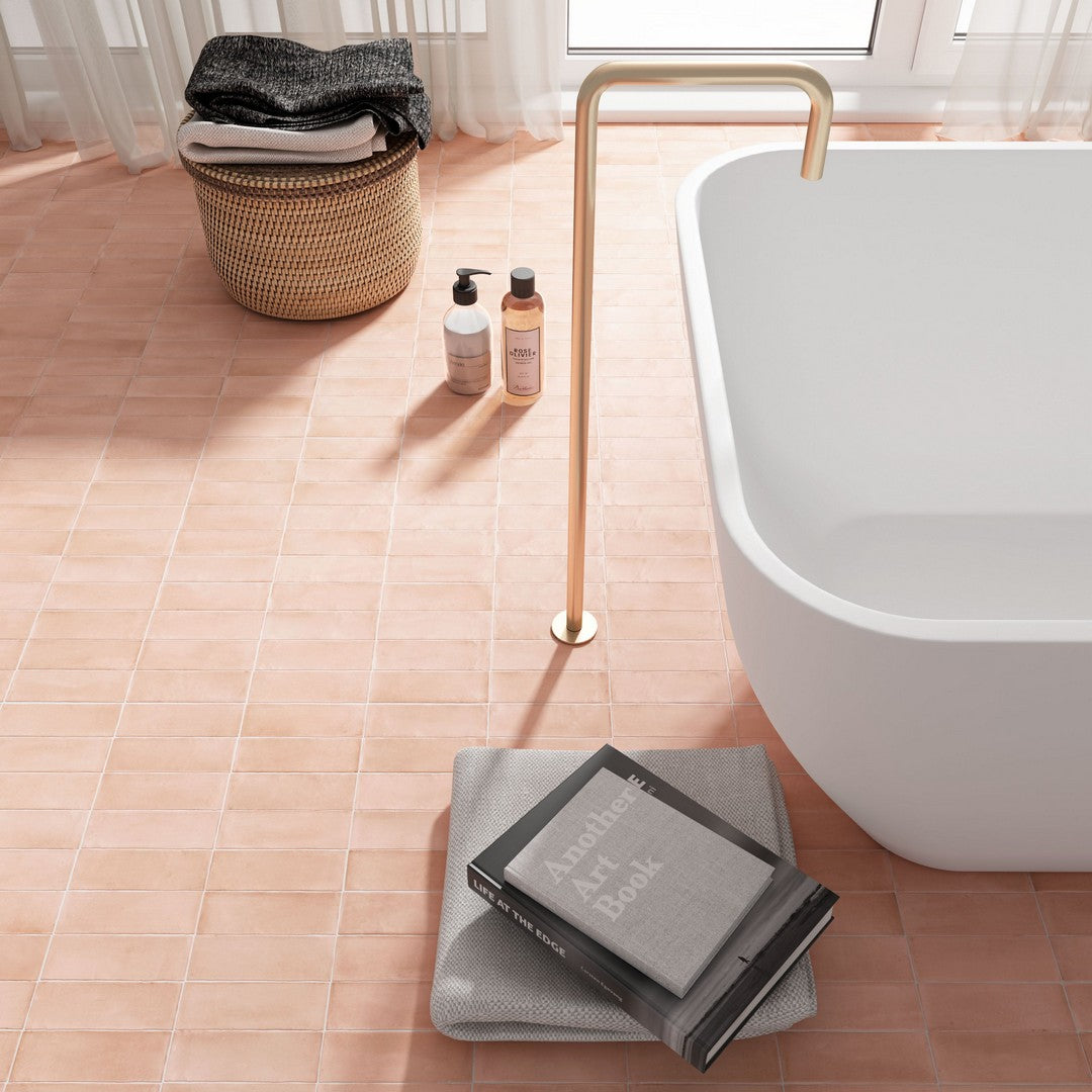 Pink Ottimo Floor Tile, Image displaying, a book, a bathtub, a caddy, cosmetic product, and a 2x6 pink ottimo tile