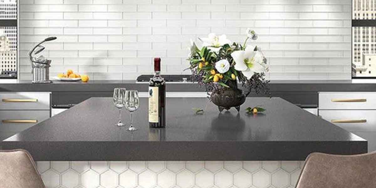 Benefits of Maniscalco Glass Tile | Image is showing kitchen counter top room scene with a backsplash tiles near sink